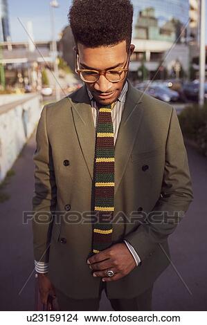 Picture - Businessman walking in city, Milano, Lombardia, Italy. Fotosearch