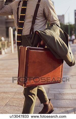 Businessman walking in city, Milano, Lombardia, Italy View Large Photo Image Stock Image - Businessman walking in city, Milano, Lombardia, Italy. Fotosearch