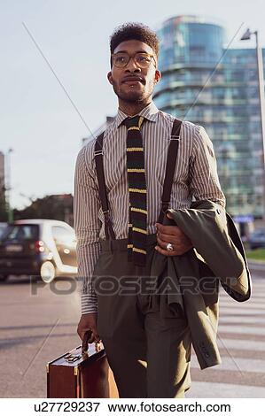 Businessman walking in city, Milano, Lombardia, Italy View Large Photo Image Stock Photo - Businessman walking in city, Milano, Lombardia, Italy. Fotosearch