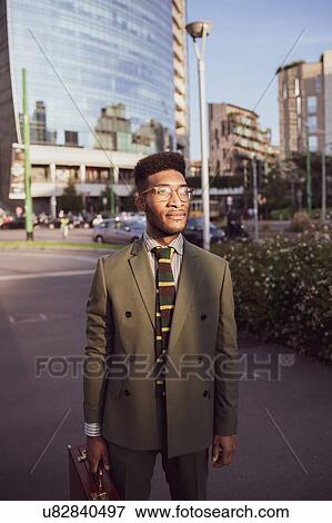Businessman walking in city, Milano, Lombardia, Italy View Large Photo Image Stock Photo - Businessman walking in city, Milano, Lombardia, Italy. Fotosearch