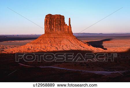 Stock Photo - Butte at sunset in Monument Valley, Arizona, USA. Fotosearch