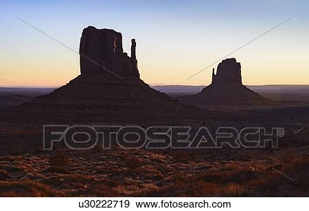 Buttes at sunset in Monument Valley, Arizona, USA View Large Photo Image Stock Photo - Buttes at sunset in Monument Valley, Arizona, USA. Fotosearch