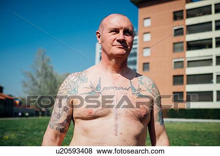 Calisthenics in park, bare chested tattooed mature man, portrait View Large Photo Image Stock Photo - Calisthenics in park, bare chested tattooed mature man, portrait. Fotosearch