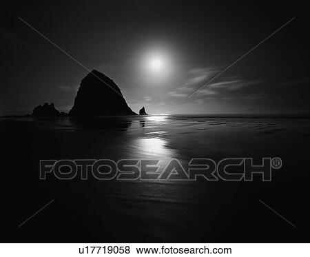 Cannon Beach at sunset in Oregon, USA View Large Photo Image Stock Photo - Cannon Beach at sunset in Oregon, USA. Fotosearch