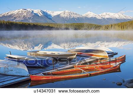 Canoes on Patricia Lake in Jasper National Park, Alberta, Canada View Large Photo Image Stock Image - Canoes on Patricia Lake in Jasper National Park, Alberta, Canada. Fotosearch