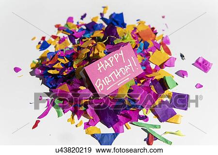 Card reading 'Happy Birthday! ' on pile on confetti View Large Photo Image Stock Photo - Card reading 'Happy Birthday! ' on pile on confetti. Fotosearch