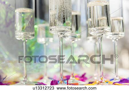 Stock Image - Champagne glasses with confetti. Fotosearch