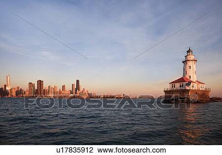 Stock Image - Chicago Harbor Lighthouse at sunrise in Chicago, Illinois, USA. Fotosearch