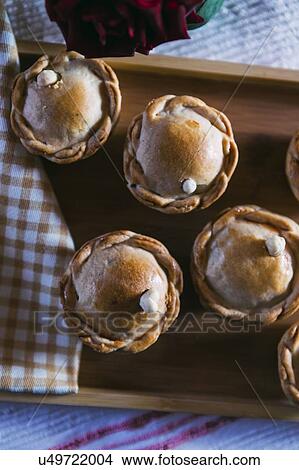 Chicken pies on wooden tray View Large Photo Image Picture - Chicken pies on wooden tray. Fotosearch