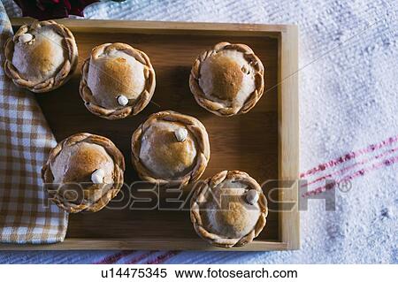 Chicken pies on wooden tray View Large Photo Image Stock Photography - Chicken pies on wooden tray. Fotosearch