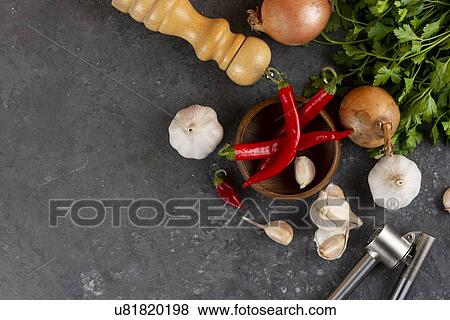 Chili peppers with garlic, onion and pepper mill View Large Photo Image Stock Photo - Chili peppers with garlic, onion and pepper mill. Fotosearch