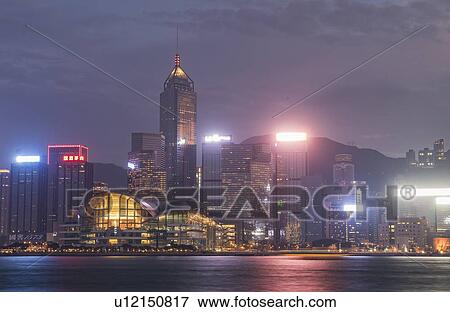 City skyline at sunset in Hong Kong, China View Large Photo Image Stock Photo - City skyline at sunset in Hong Kong, China. Fotosearch