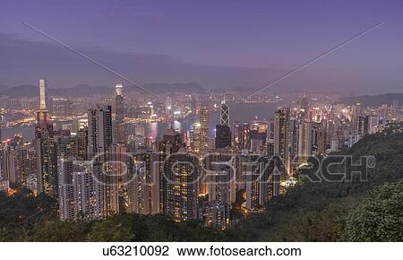 Stock Image - Cityscape at sunset from Victoria Peak in Hong Kong, China. Fotosearch