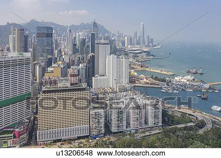 Cityscape by sea in Hong Kong, China View Large Photo Image Stock Photo - Cityscape by sea in Hong Kong, China. Fotosearch
