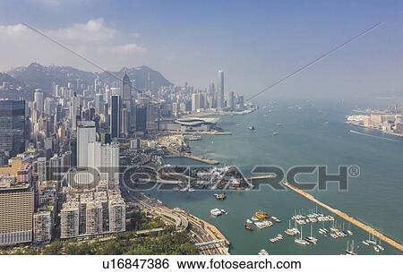 Cityscape by sea in Hong Kong, China View Large Photo Image Stock Photograph - Cityscape by sea in Hong Kong, China. Fotosearch