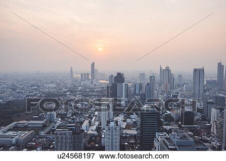 Cityscape during sunset in Bangkok, Thailand View Large Photo Image Stock Photo - Cityscape during sunset in Bangkok, Thailand. Fotosearch