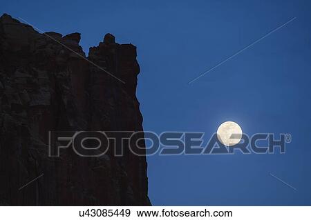Cliff by full moon in Capitol Reef National Park, USA View Large Photo Image Stock Photo - Cliff by full moon in Capitol Reef National Park, USA. Fotosearch