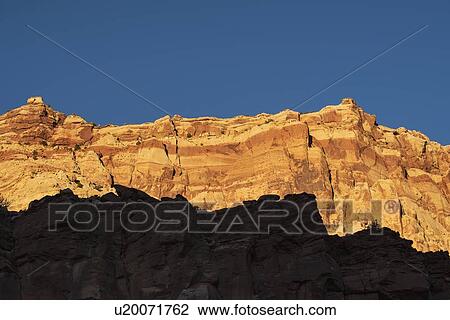 Stock Image - Cliff in shadow in Capitol Reef National Park, USA. Fotosearch