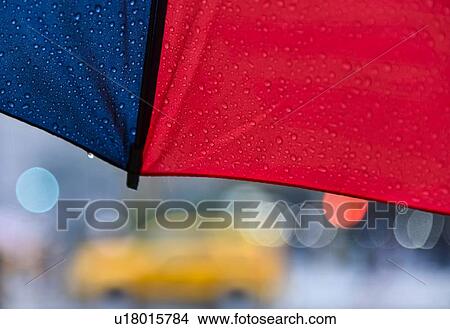 Picture - Close up of umbrella on rainy day. Fotosearch