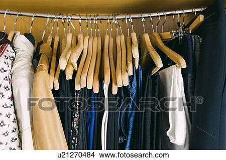 Picture - Clothes in wardrobe. Fotosearch