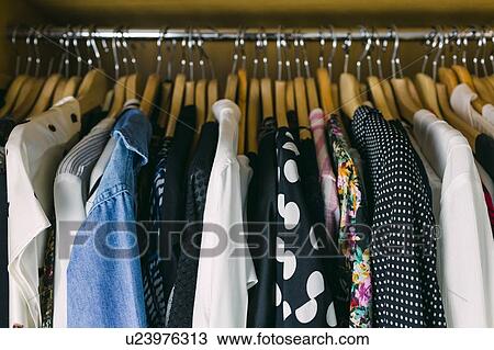 Stock Image - Clothes in wardrobe. Fotosearch