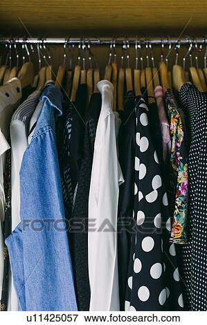 Clothes in wardrobe View Large Photo Image Stock Photo - Clothes in wardrobe. Fotosearch