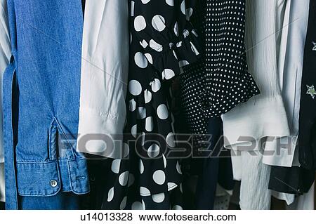 Clothes in wardrobe View Large Photo Image Stock Photo - Clothes in wardrobe. Fotosearch