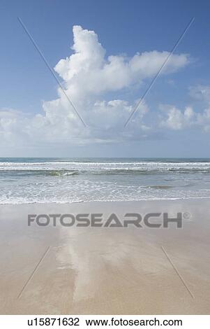 Stock Image - Clouds over beach in Surf City, North Carolina, USA. Fotosearch