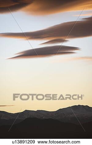 Clouds over hills at sunset in Denver, Colorado, USA View Large Photo Image Stock Photo - Clouds over hills at sunset in Denver, Colorado, USA. Fotosearch