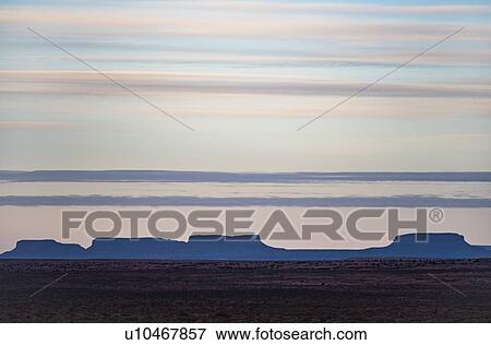 Stock Photo - Clouds over Monument Valley in Arizona, USA. Fotosearch