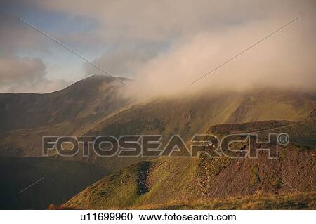 Stock Image - Clouds over the Carpathian Mountain Range. Fotosearch