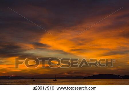 Stock Image - Cloudscape at sunset in West Railay, Thailand. Fotosearch