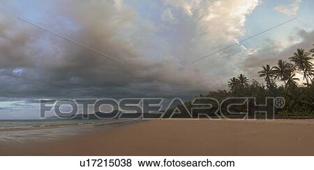 Stock Photo - Cloudscape over beach in Port Douglas, Australia. Fotosearch