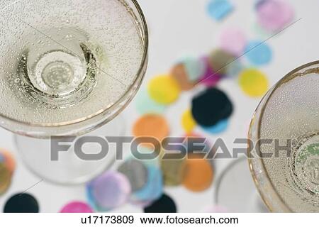 Cocktail glasses on confetti View Large Photo Image Stock Photo - Cocktail glasses on confetti. Fotosearch