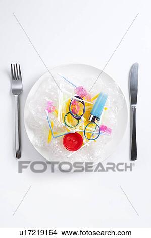 Picture - Conceptual image of plastic pollution entering the food chain.. Fotosearch