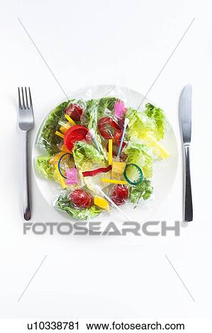Stock Image - Conceptual image of plastic pollution entering the food chain.. Fotosearch