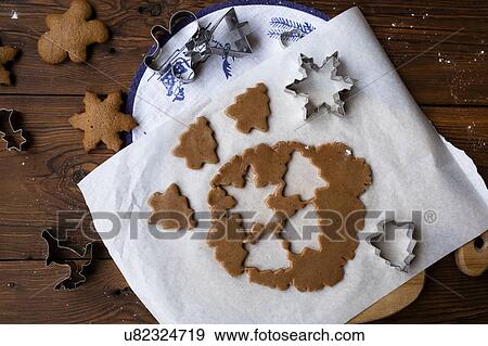 Stock Photo - Cookie dough with cut out shapes. Fotosearch