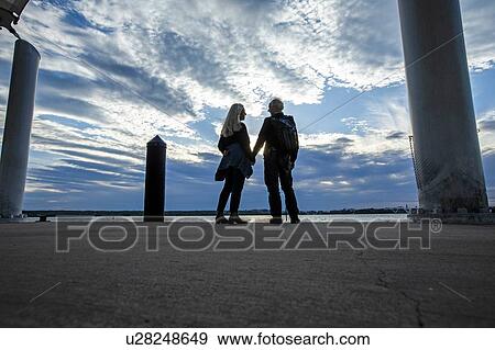 Couple by Potomac River in Washington DC, USA View Large Photo Image Stock Photo - Couple by Potomac River in Washington DC, USA. Fotosearch