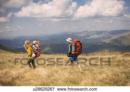 Couple hiking in the Carpathian Mountain Range View Large Photo Image Stock Photo - Couple hiking in the Carpathian Mountain Range. Fotosearch