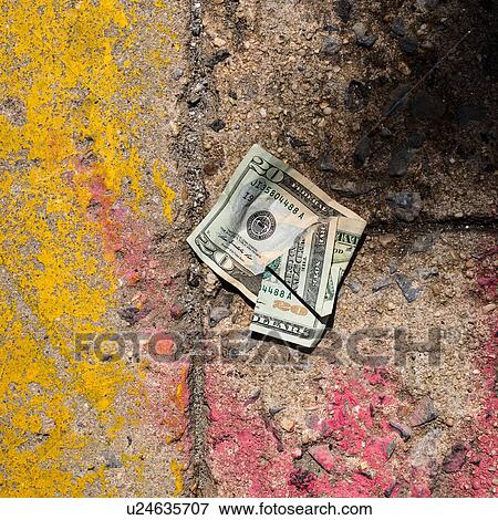 Stock Photo - Crumpled money on sidewalk. Fotosearch
