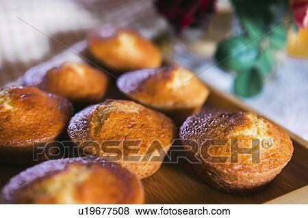 Stock Photo - Cupcakes on wooden tray. Fotosearch