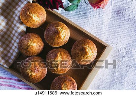 Cupcakes on wooden tray View Large Photo Image Stock Photograph - Cupcakes on wooden tray. Fotosearch