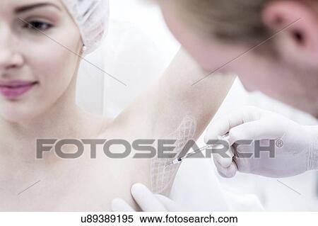 Dermatologist injecting botox in underarm to treat excessive sweating, close-up. View Large Photo Image Stock Photography - Dermatologist injecting botox in underarm to treat excessive sweating, close-up.. Fotosearch