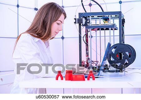 Designer working with 3D printer. View Large Photo Image Stock Photo - Designer working with 3D printer.. Fotosearch
