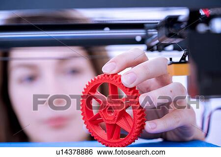 Stock Photograph - Designer working with 3D printer.. Fotosearch
