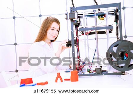 Stock Photography - Designer working with 3D printer.. Fotosearch