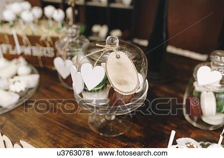 Stock Image - Desserts in cake stand during wedding. Fotosearch
