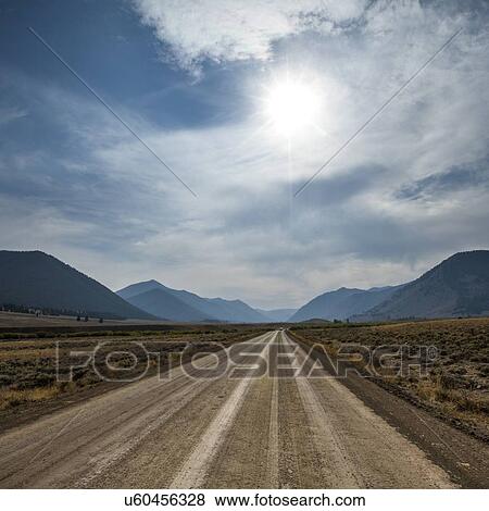 Stock Photo - Dirt road through Sun Valley, Idaho, USA. Fotosearch