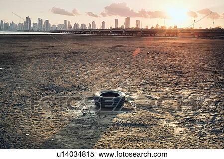 Discarded tyre on seashore, Costa del Este, Ciudad de Panam, Panama View Large Photo Image Stock Photography - Discarded tyre on seashore, Costa del Este, Ciudad de Panam, Panama. Fotosearch