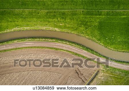 Ditch, dyke, ploughed field and pasture, overhead view, Maasdijk-Heenweg, Zuid-Holland, Netherlands View Large Photo Image Stock Photo - Ditch, dyke, ploughed field and pasture, overhead view, Maasdijk-Heenweg, Zuid-Holland, Netherlands. Fotosearch